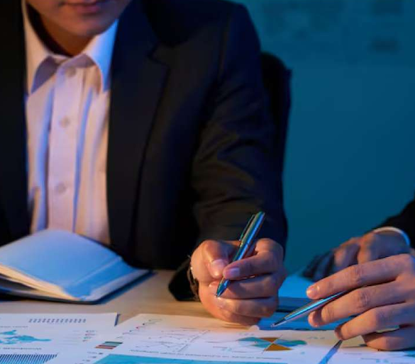 People at a table writing notes.